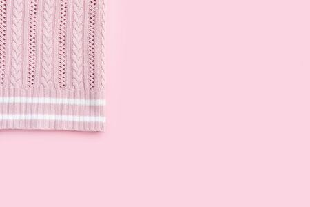 Beautiful taken stylish fashionable cotton pink sweater on bright rose background.
Flat lay Top view...