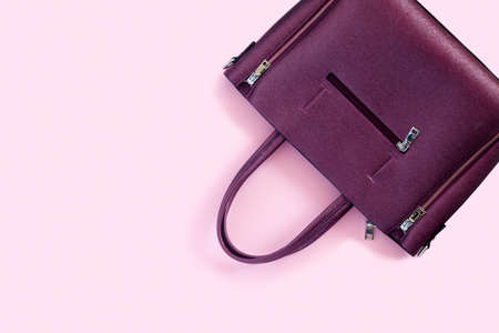 Woman's accessories flat lay on colorful background. Top view purple and pink pastel colors with copy space around products. Horizontal image or photograph.の写真素材