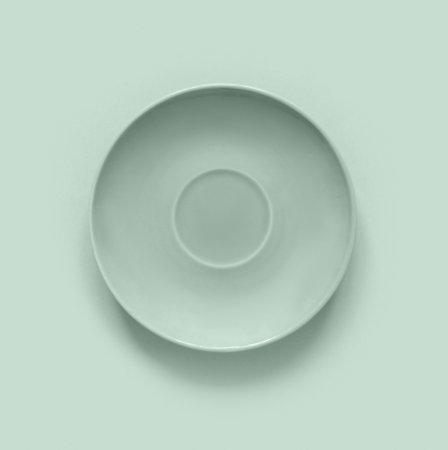 Mint color plates on mint table. Monochrome minimalistic image in hipster style. Flat lay, top view, copy space for text. Creative background.の写真素材