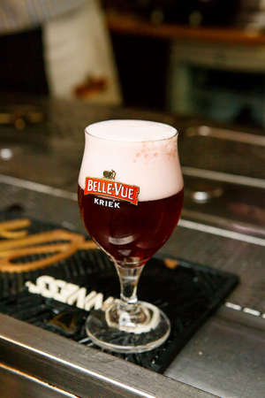 Minsk, Belarus - June 2020: Glass of Belgian Bellevue Kriek fruit beer