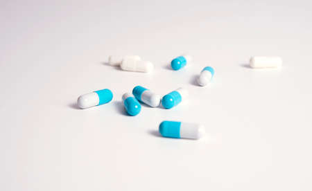 White and medical pills on white backgroundの写真素材