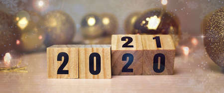 Business and design concept - surreal abstract geometric floating wooden cube with word 2020 2021...