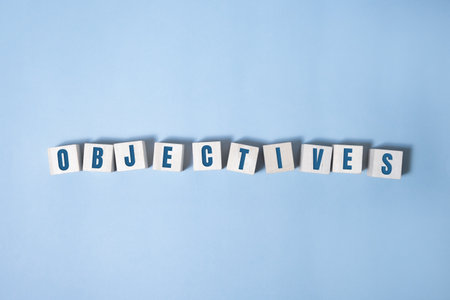 objective word written on wood block. objective text on table, concept.の写真素材