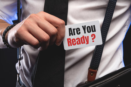 Businessman putting a card with text Are You Ready.の写真素材