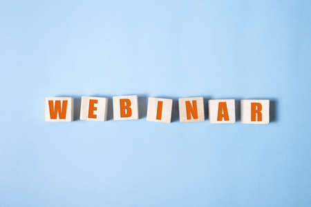 WEBINAR word on wooden cubes ob blue backgroundの写真素材