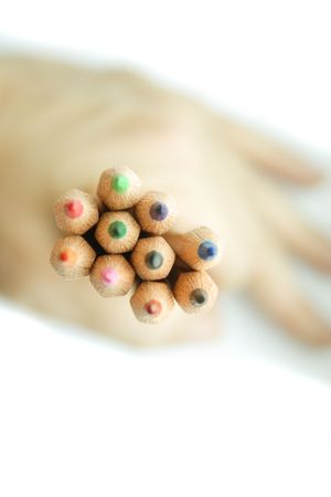 colour pencils on the handの写真素材