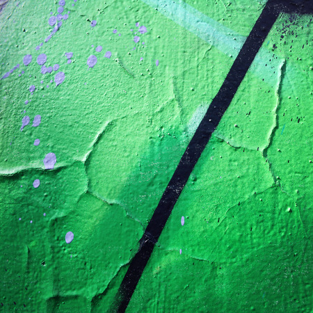 Frame for text. Urban wall close-up. Bright paint on concreat surface. Aged photo. Retro photo. Vintage effect. Street graffiti close up. Color wall macro background. Toned filter.の写真素材