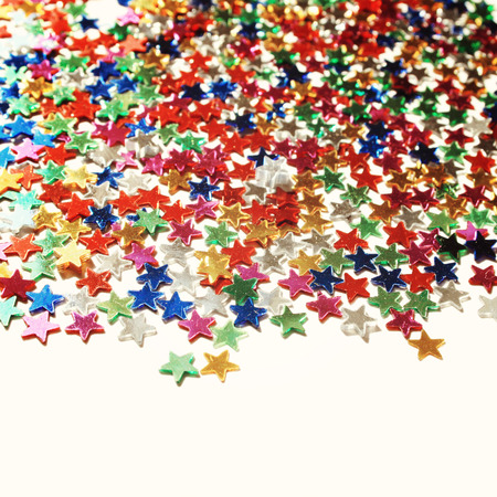 Star background with copy space. Macro. Scattered glittering stars confetti. Vintage photo. Text...