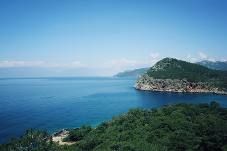 View of Mediterranean Sea from Cape Gelidonya. Pine trees on the southern coast of Turkey. Calm blue sea and clear sky. Spring sunny day in Antalya province, Turkey.の写真素材