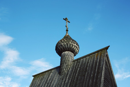 Small wooden chapel. Low Point of View photo. Chapel of St. Nicholas in Vershinino Village. One of Kenozersky National Park symbols. Kenozero, Arkhangelsk region, Russia.の写真素材