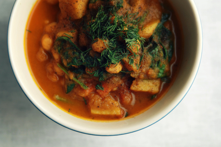 Simple vegetable soup. European cuisine. Chickpeas, potato and carrot. Organic food. Vegan dish. Vegetarian lunch. Top view.の写真素材