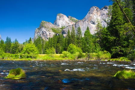 Three Brothers Rock and Merced River in Yosemite National Park, Californiaの写真素材