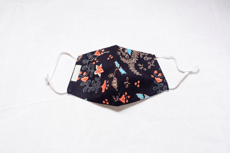 design for face mask  with random plants pattern black base color  and white backgroundの写真素材