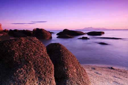 Beautiful sunrise at the beach in Penang, Malaysia. Silky smooth water. Long exposure shot.の写真素材