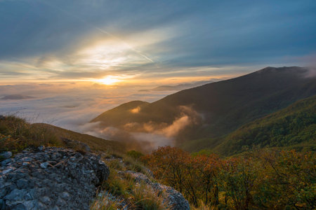 Sunrise over the clouds, mount Cucco, Umbria, Apennines, Italyの写真素材