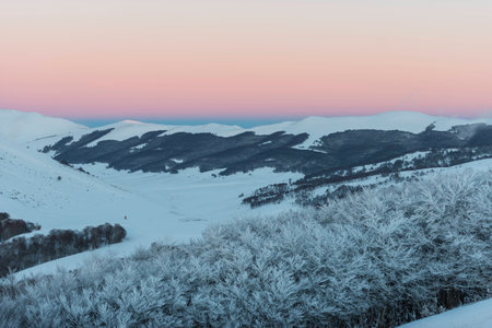 Sunset on the mountains in winter with snow, Sibillini mountains NP, Umbria, Italyの写真素材