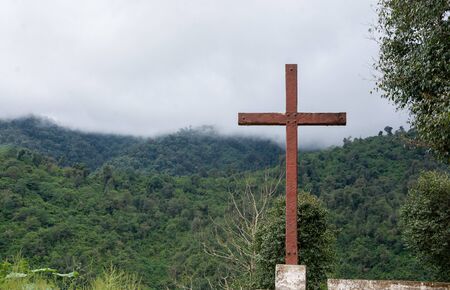 Wooden cross on lush mountain top. Viewpoint called "Mirador de la Cruz" next to "Virgen the las Flores". Quebrada de los Sosa, Tucuman. Argentinaの写真素材