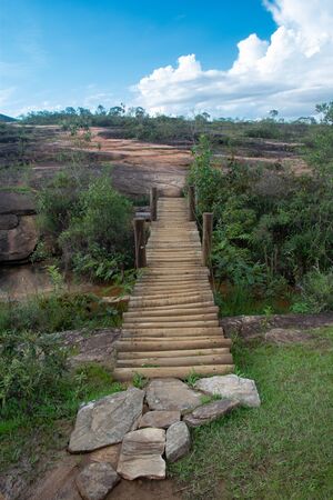 Wooden pathway in a rural scenery. Das Andorinhas, Ouro Preto. Brazil