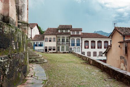 OURO PRETO, MINAS GERAIS, BRAZIL - DECEMBER 22, 2019: Colonial style houses in Largo do Rosario, Ouro Preto - Brazil. Ouro Preto was designed a World Heritage Site by UNESCO in 1980 because of its outstanding Baroque Portuguese colonial architecture.のeditorial素材