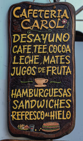 COROICO, BOLIVIA - AUGUST 1, 2016: Detail of advertising banner displaying the different options of food offered in a restaurant of Coroico, Boliviaのeditorial素材