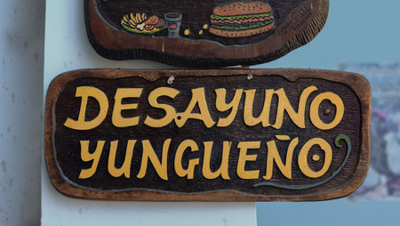 COROICO, BOLIVIA - AUGUST 1, 2016: A restaurant sign with the text "Desayuno yungueÃ±o" (breakfast from the Yungas) in a market of Coroico, Bolivia.のeditorial素材