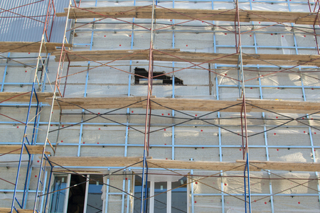 scaffolding on the facade of the winterの写真素材