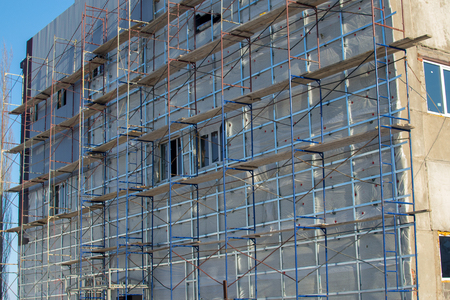 scaffolding on the facade of the winterの写真素材