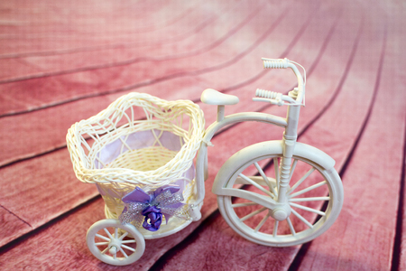 Decorative bicycle from a vine with flowersの写真素材