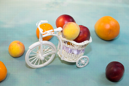 fruit on a light blue background with a decorative Bicycleの写真素材