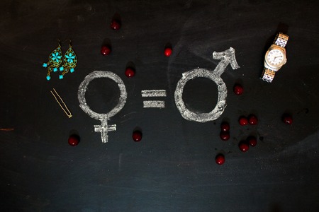 Gender symbols or signs for the male and female sex drawn on a blackboardの写真素材