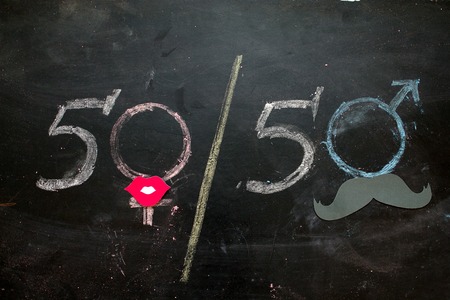 Gender symbols or signs for the male and female sex drawn on a blackboardの写真素材