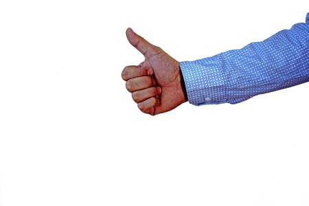 Male hand showing his thumb up isolated on white. Positivity concept.の写真素材