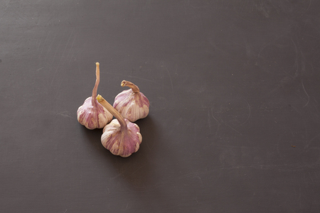 Garlic heads on black chalk Board background vintage background.の写真素材