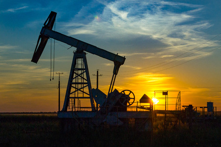 Oil Pump on orange sunsetの写真素材
