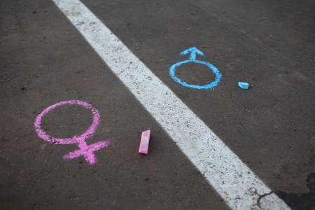 Legs with gender symbol on asphalt, gender conceptの写真素材