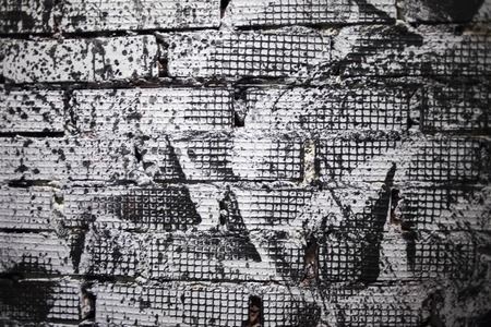 wall of bricks painted in black and whiteの写真素材