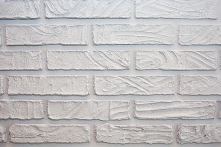 Decorative bricks made of gypsum plaster. Painted in grey. white brick wall textureの写真素材