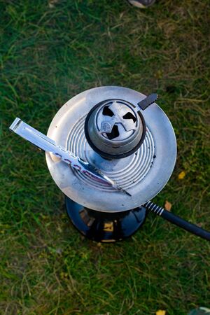 Hookah bowl with red hot coals. Silver bowl for shisha coals. Hookahの写真素材