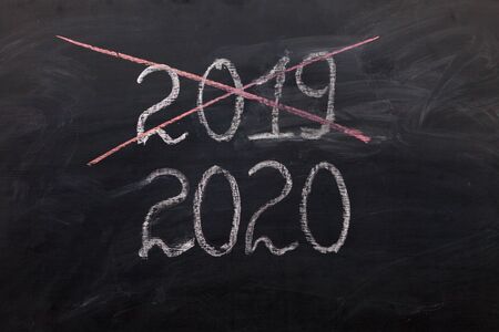 happy new year 2020. Chalkboard with 2020, crossed 2019の写真素材