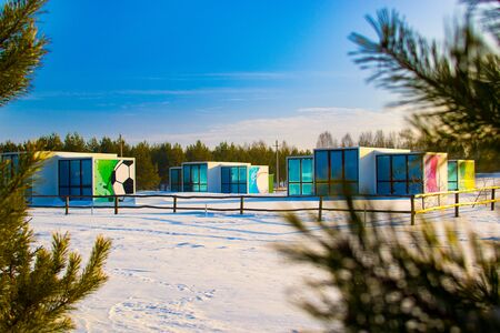 Beautiful houses in the winter recreation Park. Prefabricated houses made of sandwich panels. Frame construction. Russiaの写真素材