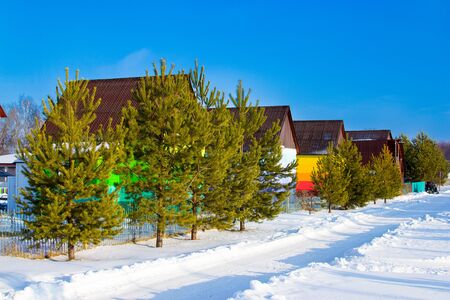 Colorful houses in the Russian village. Recreation Park, winter holidays. Bashkortostan Republicの写真素材