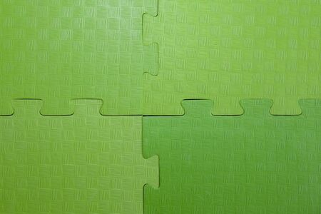 soft mats in the form of a puzzle, the joint of mats in the kindergarten gymの写真素材