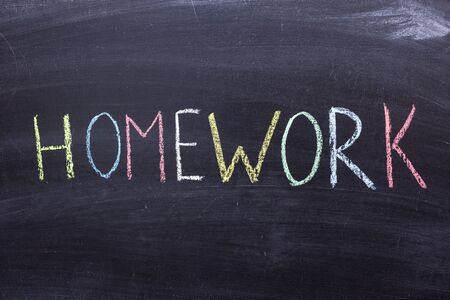 Work from home. Text with colored crayons on the blackboardの写真素材