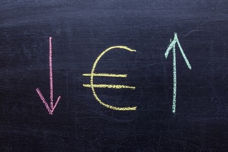 Euro icon blackboard White Chalk. Euro symbol arrows up and down. School board euro symbols. euro falls increases. euro pictureの写真素材