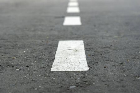 Road Marks. white stripes on the road stretching into the distance