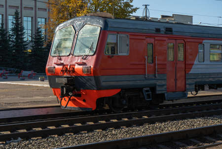 Old electric train arrives at a railway station in Russia