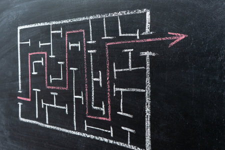Drawing of a maze on a chalk Boardの写真素材