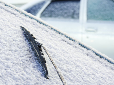 The rear window of the car is covered with frost in winterの写真素材