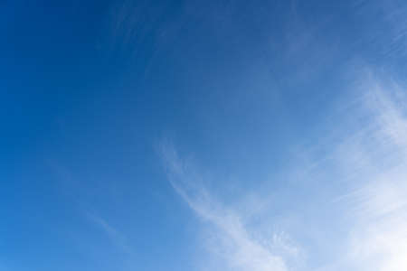 Blue morning sky with cumulus clouds, calm sceneの写真素材