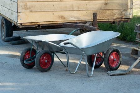 Two new hand wheelbarrows on a construction site